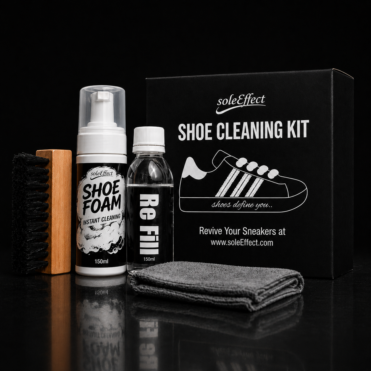 soleEffect shoe cleaning kit with foam, Refill, brush, and microfibre cloth on a black background