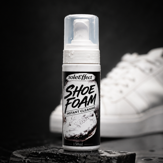 Bottle of soleEffect Shoe Foam with a white sneaker in the background